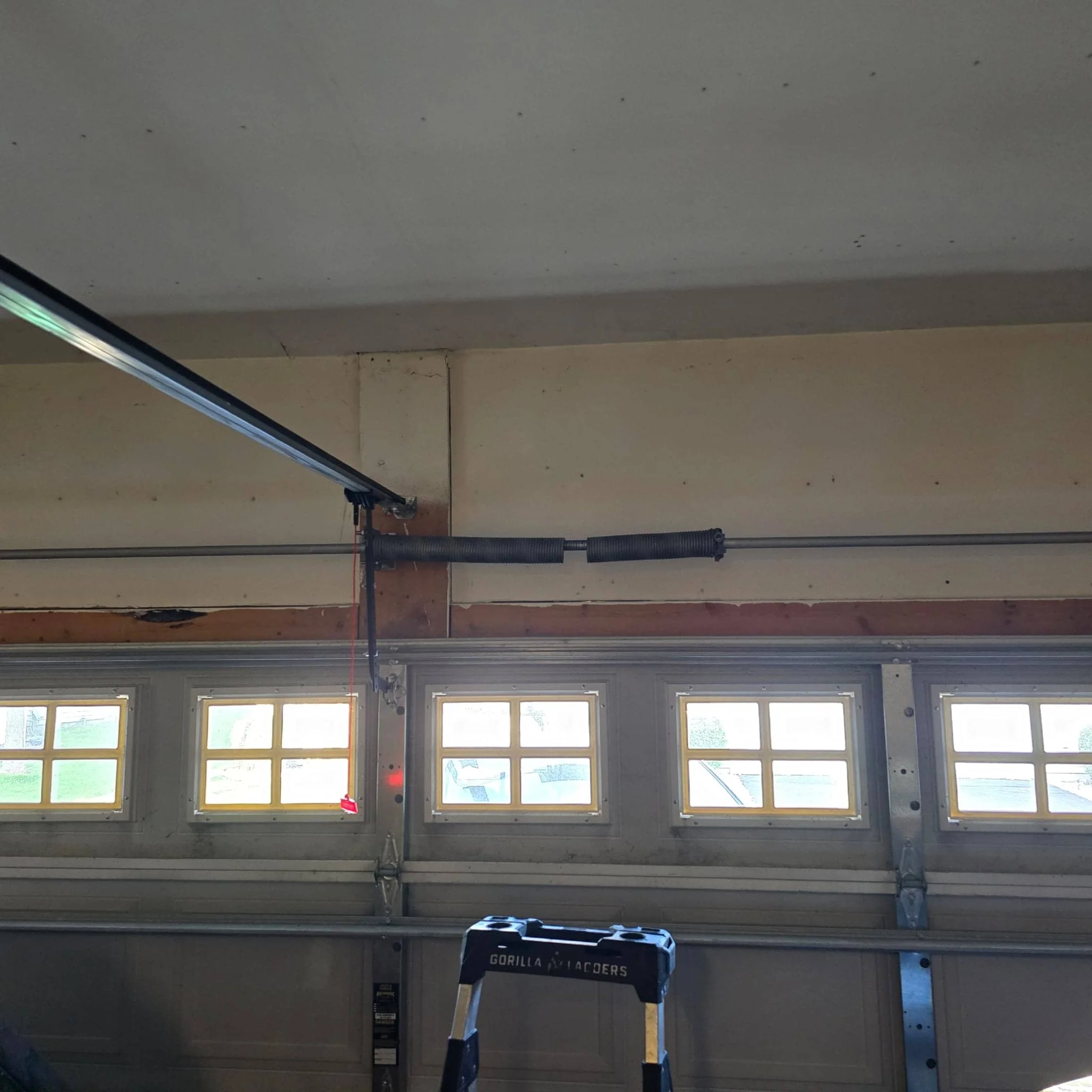 garage door spring repair before